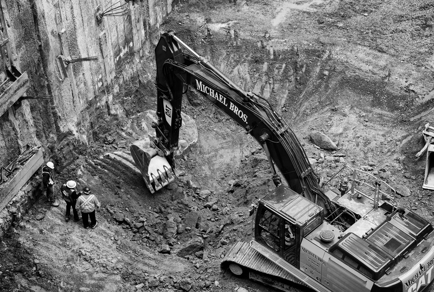 Retro excavator digging on a construction site - The One